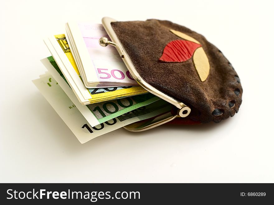 Purse full of euros on a white background