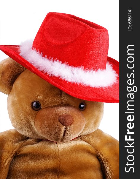 Big brown teddy bear with a santa hat on is head. Big brown teddy bear with a santa hat on is head.