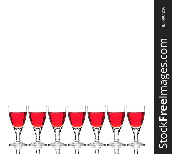 Wine glasses with red cocktail on white background