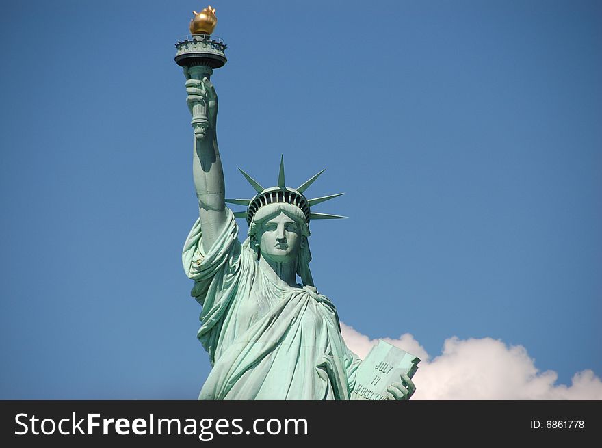 Statue of Liberty against blue sky in New York