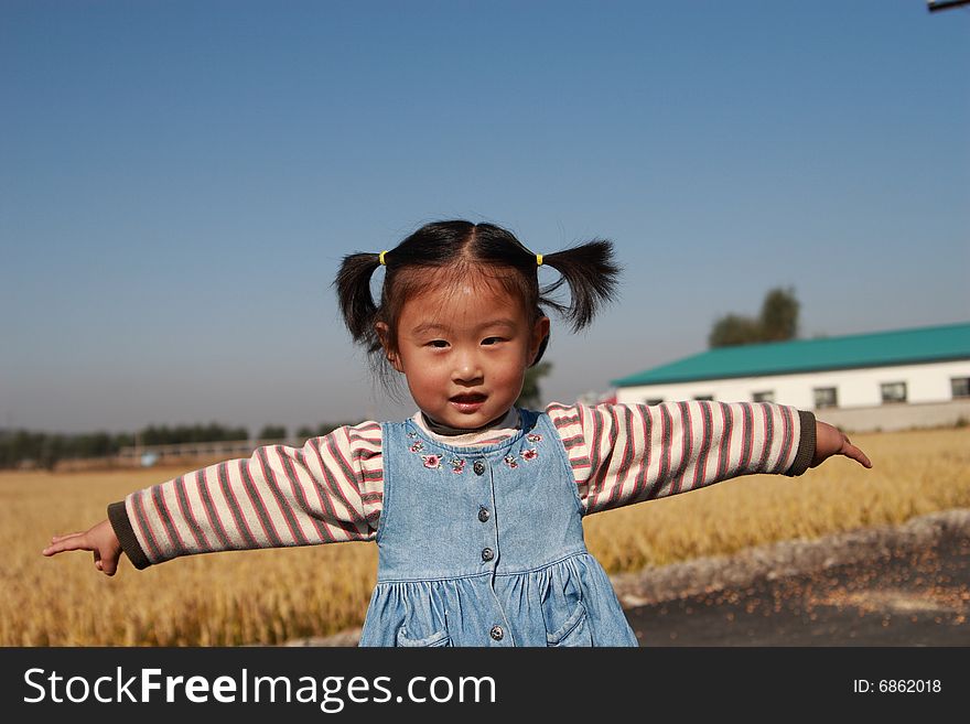 Happy Chinese little girl countryside outdoors one person. Happy Chinese little girl countryside outdoors one person