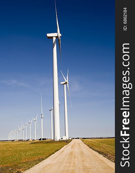 Photo of wind turbines field.