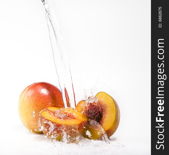 Water splashing fresh fruits on white background. Water splashing fresh fruits on white background