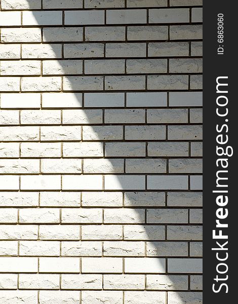 White brick wall with a shadow, background