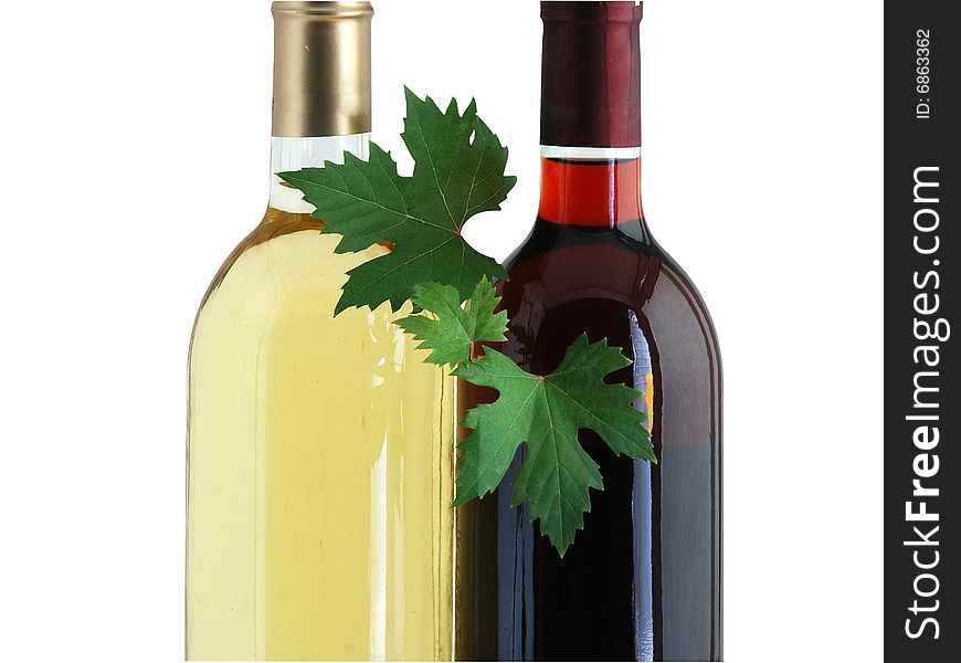 Bottles Of Red And White Wines With Grape Leafs