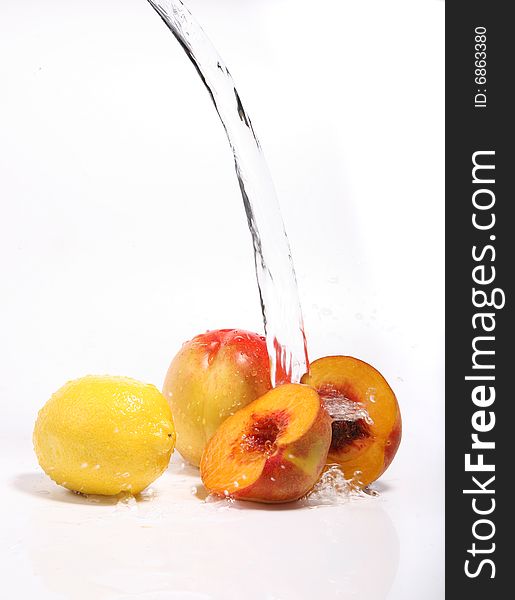 Water splashing fresh fruits on white background. Water splashing fresh fruits on white background