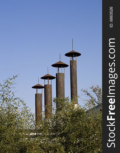 Industrial chimney against blue sky