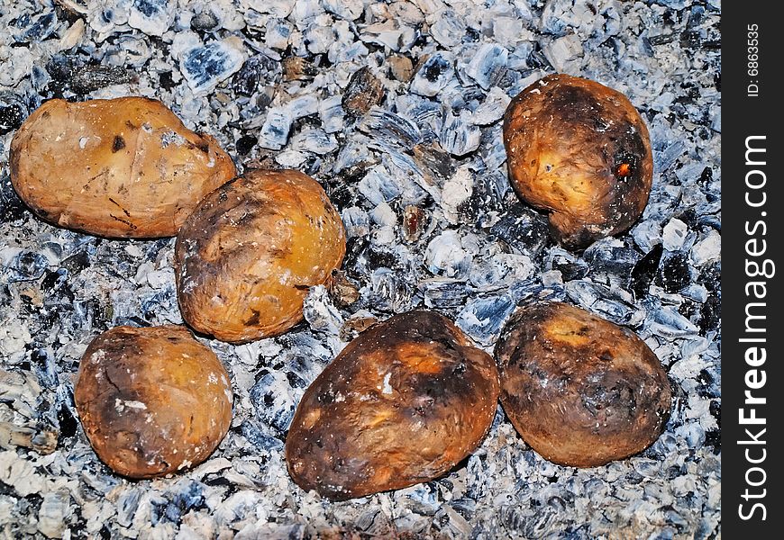 Potato on coals.