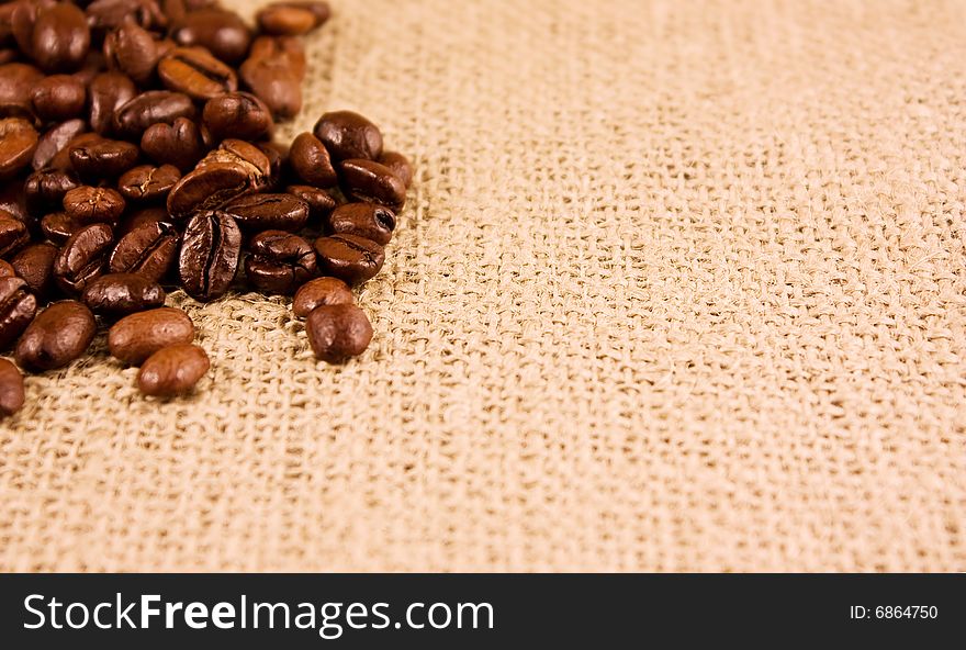 Coffee beans isolated on a jute background. Coffee beans isolated on a jute background