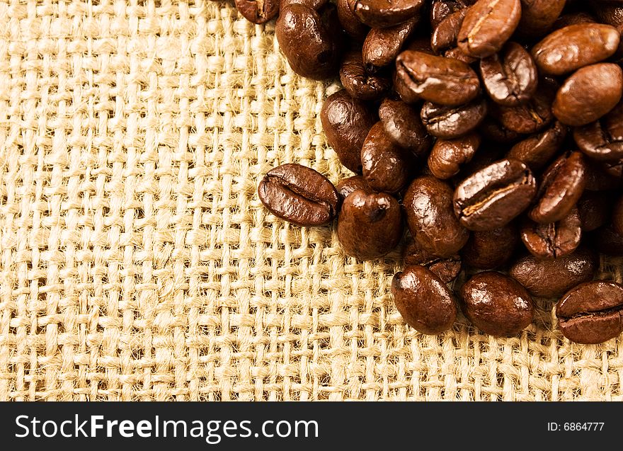 Coffee beans isolated on a jute background. Coffee beans isolated on a jute background