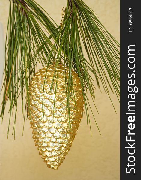 Golden decoration holding from the pine tree. Golden decoration holding from the pine tree