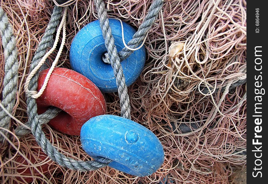 Detail os several buoys in a fishing net