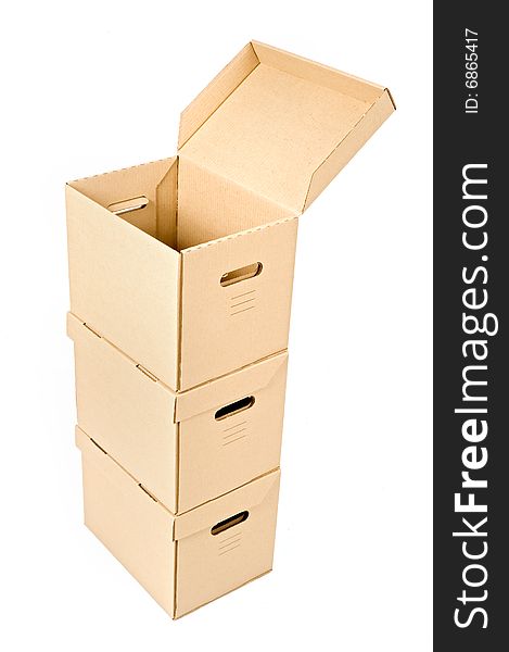 One open cardboard box on two others isolated on white. One open cardboard box on two others isolated on white