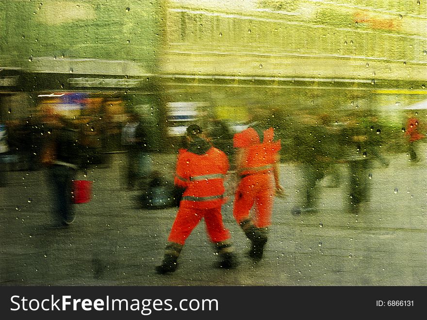 Two red men.
Blurred people walking fast home from job.
Be reflected in gold mirror with raindrops.