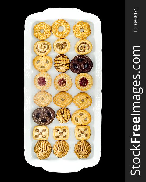 A white tray with an assortment of different kinds of teacakes