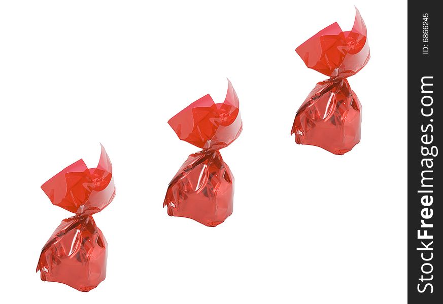 Three pieces of sweets in red wrappers - confectionery - close up. Three pieces of sweets in red wrappers - confectionery - close up