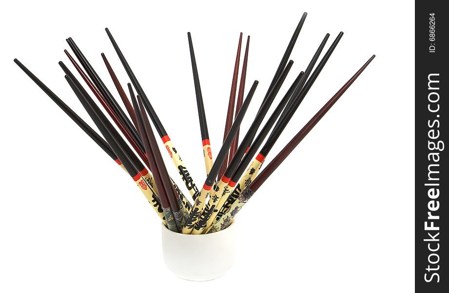 Chopsticks in cup. Ceramic cup. Fan of the sticks to eat. Chopsticks in cup. Ceramic cup. Fan of the sticks to eat