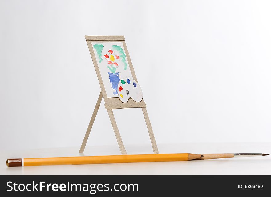 Small easel close up over white background