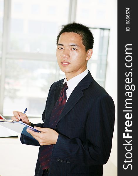 A young asian working in office