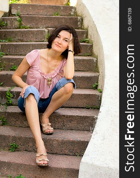 Woman sitting on a staircase