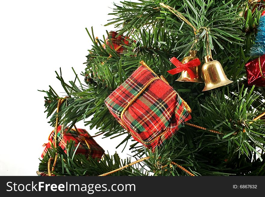 Miniature present on Christmas tree with other ornaments. Miniature present on Christmas tree with other ornaments