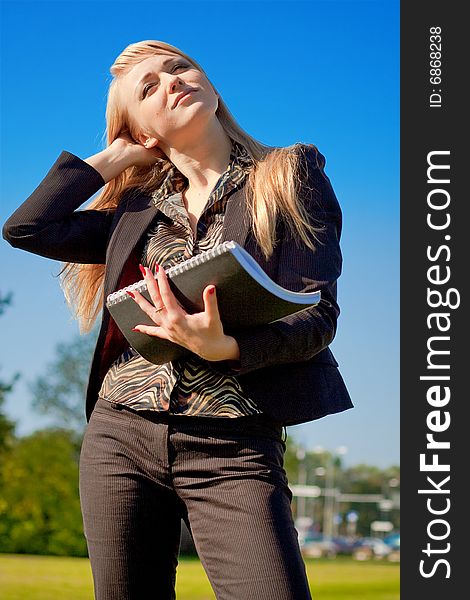 Businesswoman Holding Writing-book