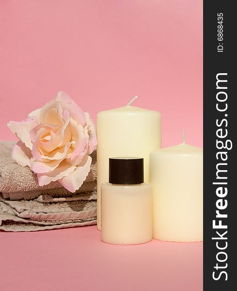 Refreshing spa luxury with candle, rose and beige spa towel. Refreshing spa luxury with candle, rose and beige spa towel