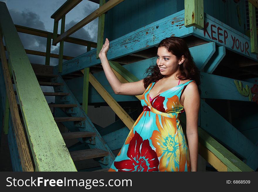 Young woman smiling and waving to friends