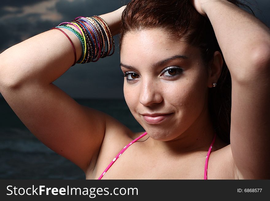 Young female smiling over her shoulder. Young female smiling over her shoulder