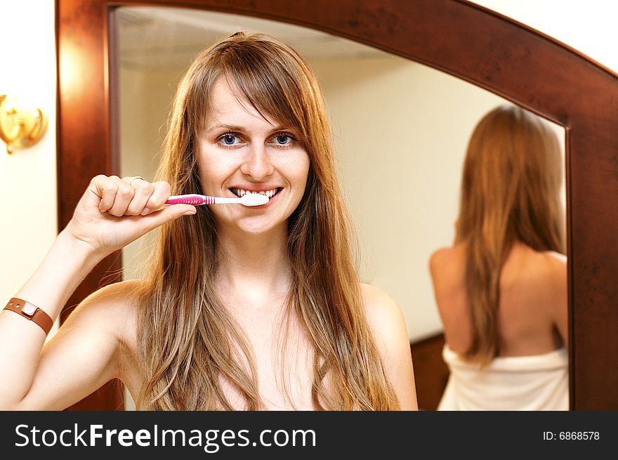 Pretty smiling girl with toothbrush