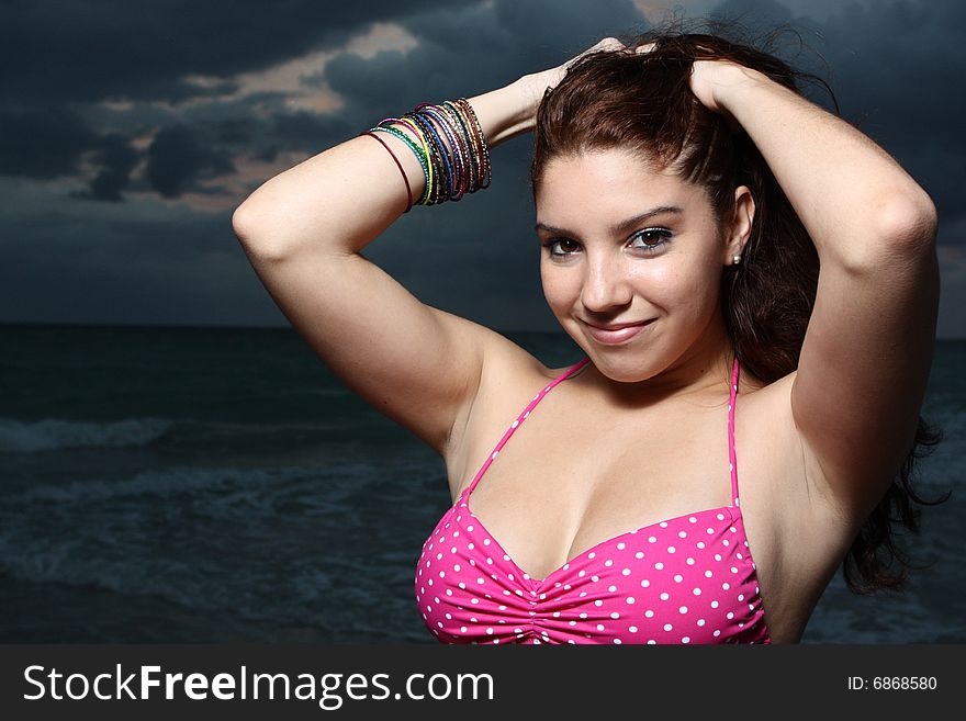 Young female posing in a pink bikini. Young female posing in a pink bikini