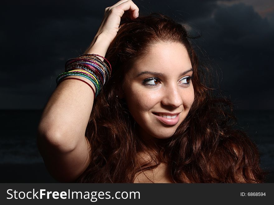 Young female smiling over her shoulder. Young female smiling over her shoulder