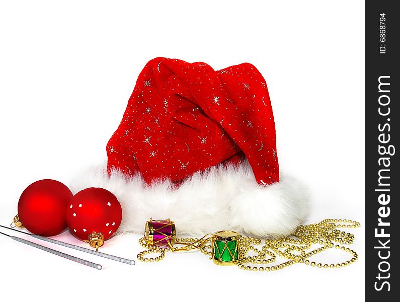 Close up of a Santa Claus hat and two spheres. Close up of a Santa Claus hat and two spheres