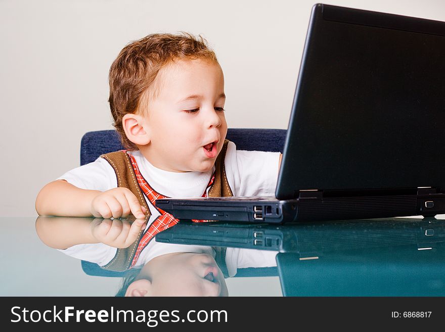 Small boy with a laptop