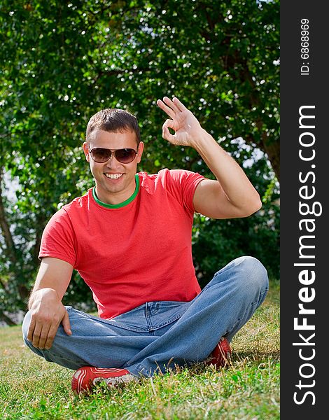 Young Man Giving OK Gesture