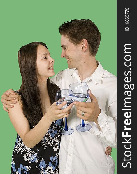 Couple drinking and smiling over green screen