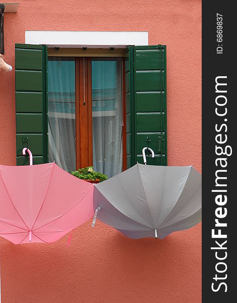 Burano house with umbrellas colorful, colors