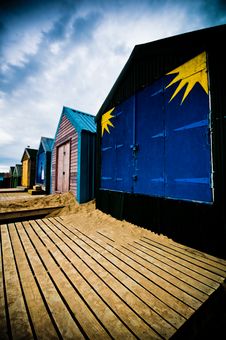 Colourful Beach Huts With Dramatic Sky Stock Images Colourful Beach Huts With Dramatic Sky Stock Images