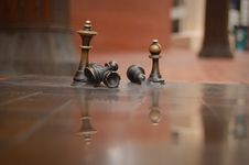 Brass Chess Figures On Reflective Surface Royalty Free Stock Photography Brass Chess Figures On Reflective Surface Royalty Free Stock Photography