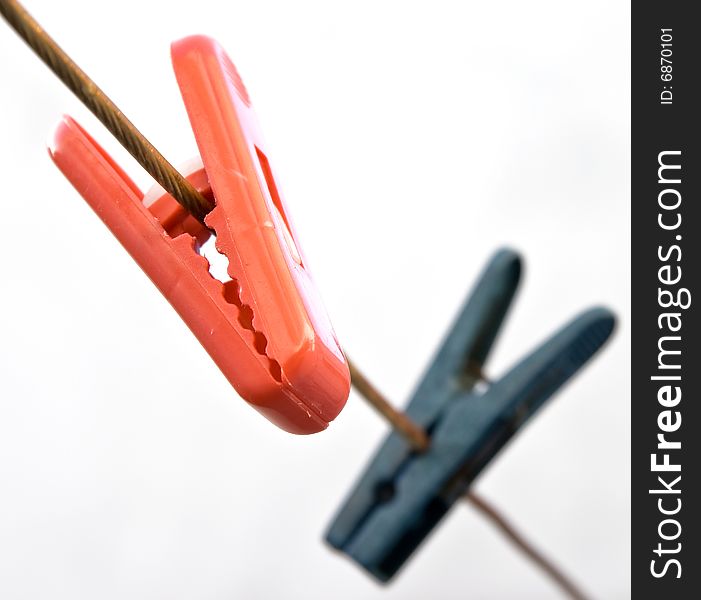 Blue and Red Plastic Clothes Pins.