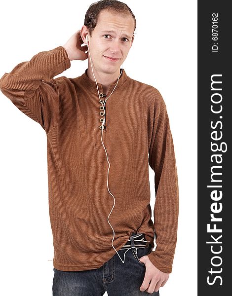 Young caucasian man wearing trendy clothes listening to music. Isolated on white background. Young caucasian man wearing trendy clothes listening to music. Isolated on white background
