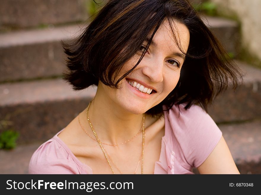 Portrait of attractive smiling brunet woman