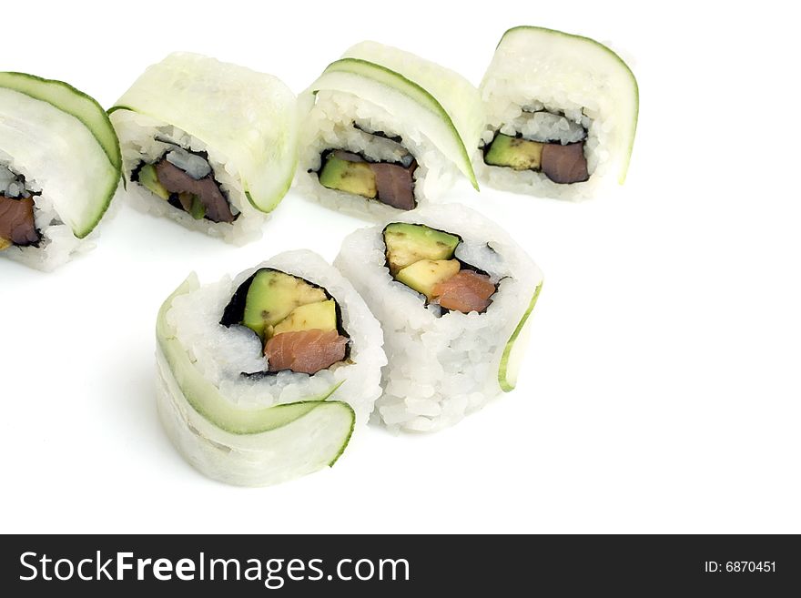 Sushi rolls with avocado, salmon, cucumber are isolated on white background