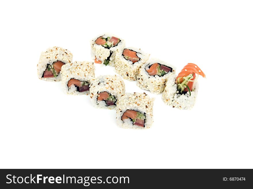 Sushi rolls with salmon, cucumber and tomato are isolated on the white background