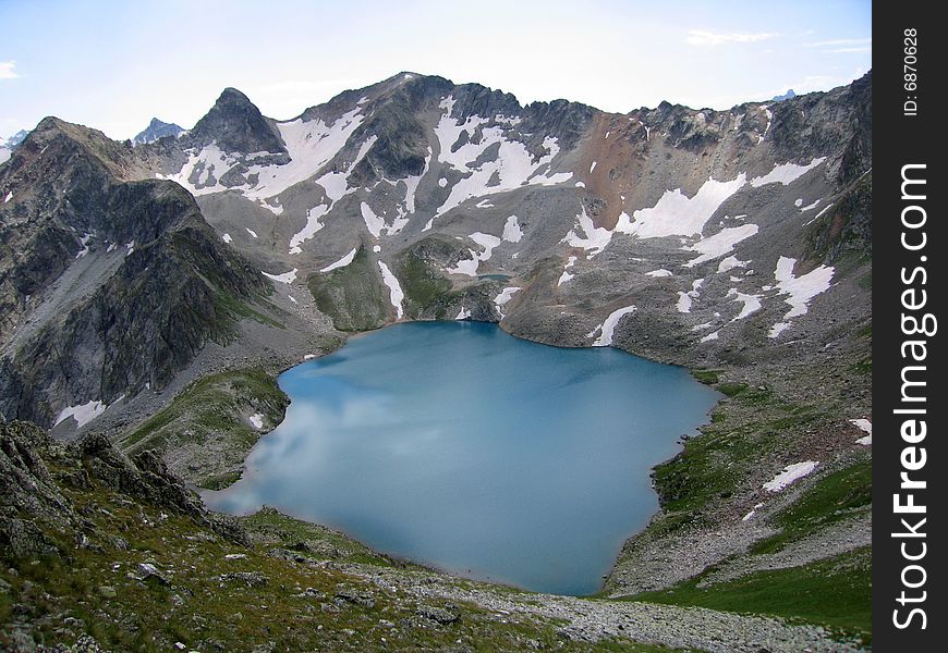 Blue Lake - one of two lakes in the Murundzhu valley, North Caucasus Mountains, Russia. Blue Lake - one of two lakes in the Murundzhu valley, North Caucasus Mountains, Russia