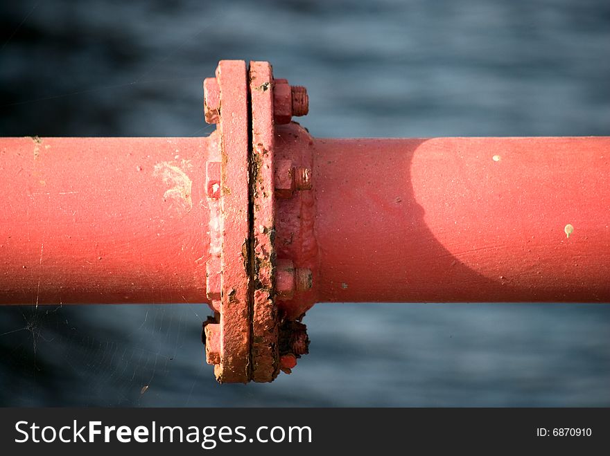 The old rusty pipe  and bolts