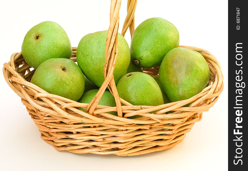 Close up on basket with green pears