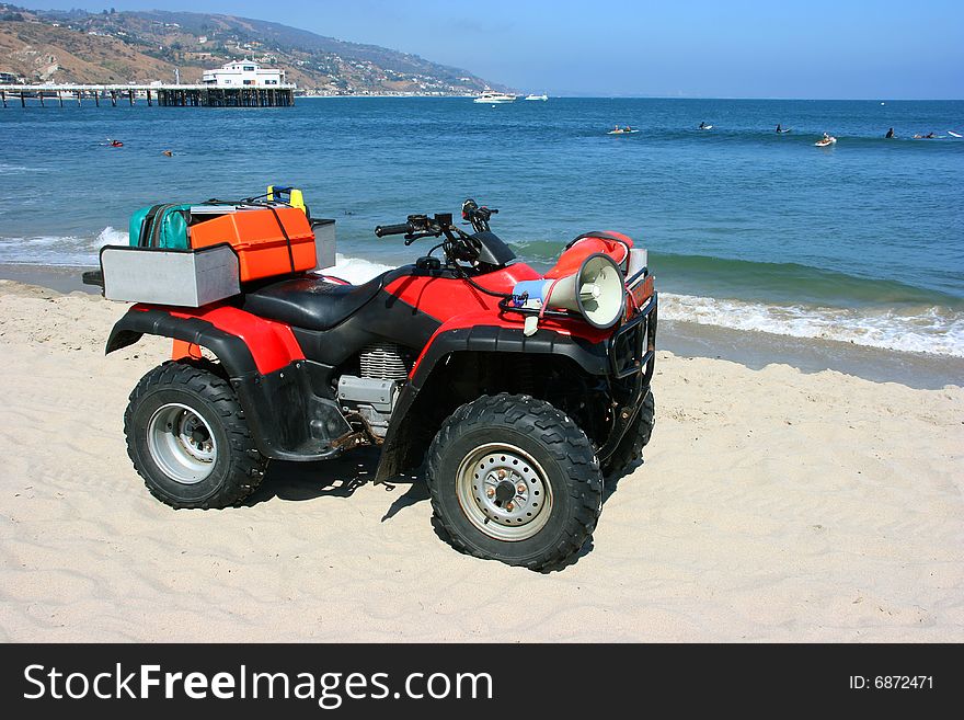 Lifeguard's car on the beach ready for rescue. Lifeguard's car on the beach ready for rescue