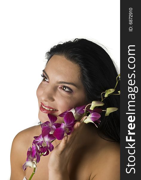 Woman with orchid looking away,more spa photos in Spa,aromatherapy ,massage