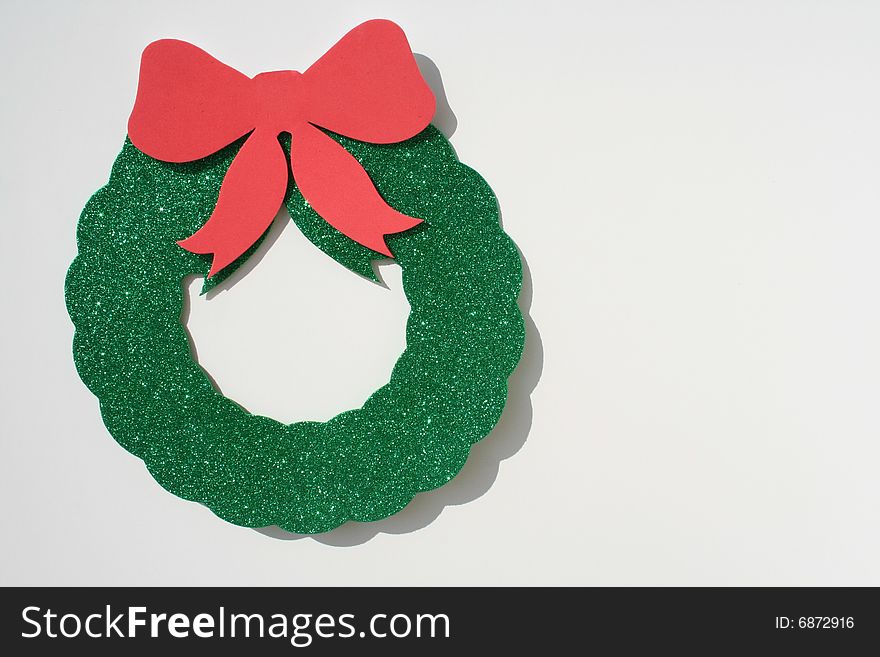 Green wreath with a red bow. Green wreath with a red bow.